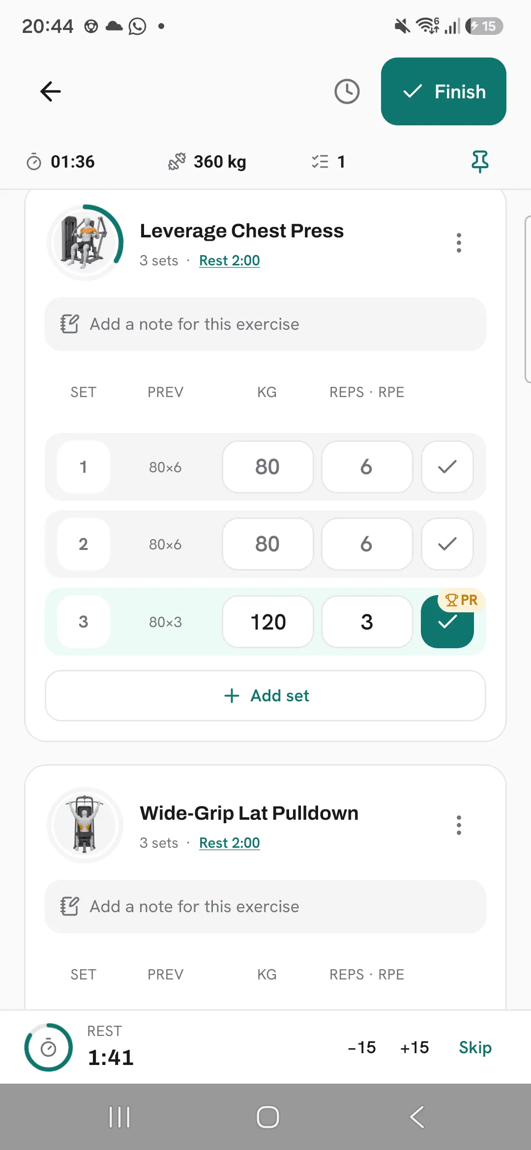 A running workout where the third set of Leverage Chest Press, 120 kg for 3 reps, is ticked and marked with a trophy PR badge.