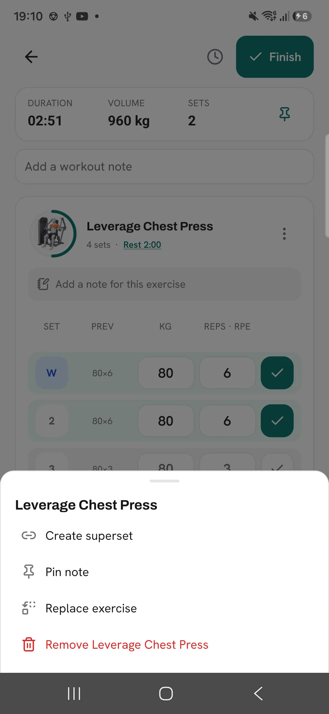 The exercise menu for Leverage Chest Press with Create superset, Pin note, Replace exercise and Remove.